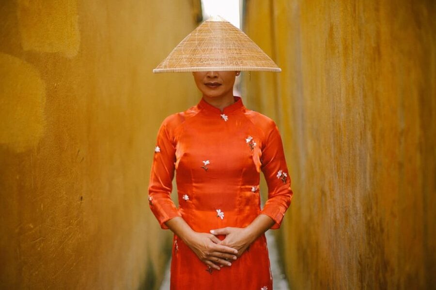 Ao Dai Photography: Traditional Attire Capture in Hoi An - Dressing Details: Ao Dai, Hat, and Sandals
