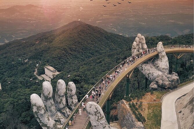 Ba Na Hills - Discover Golden Bridge - Linh Chua Linh Tu temple: panoramic Da Nang in misty afternoon light