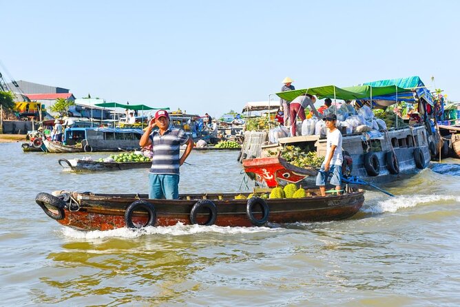 Cai Rang Floating Market & Mekong Delta 2-Day Tour from HCM City - Day 1: Vinh Trang Pagoda and Ben Tre coconuts