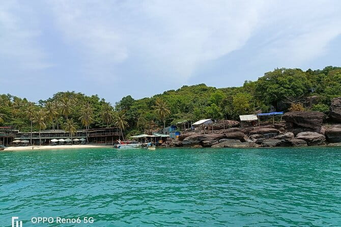 Cham Island: Snorkeling Tour - Boarding at Cua Dai Wharf, with a real wooden boat vibe