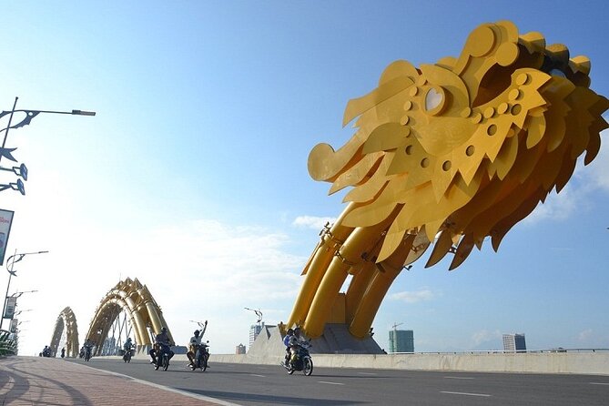Da Nang Food Tour Motorbike & Sightseeing By Ao Dai Lady Rider - Stop 2: Dragon Bridge and the water and fire show timing