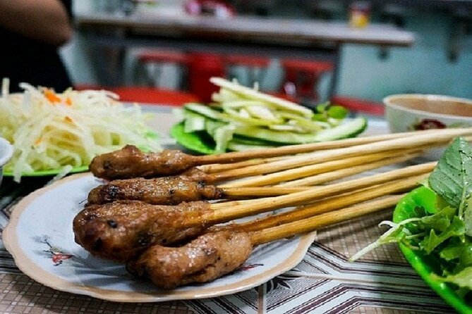 Da Nang Night Foodie Tour City and Han River Cruise By Private - Your private host in Ao Dai, and why it matters after dark