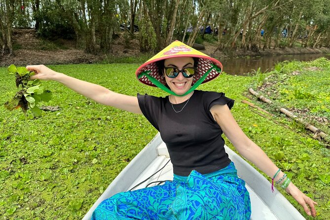 Explore Trasu Cajuput Forest - Tra Su Bird Sanctuary: the boat glide through lotus canals