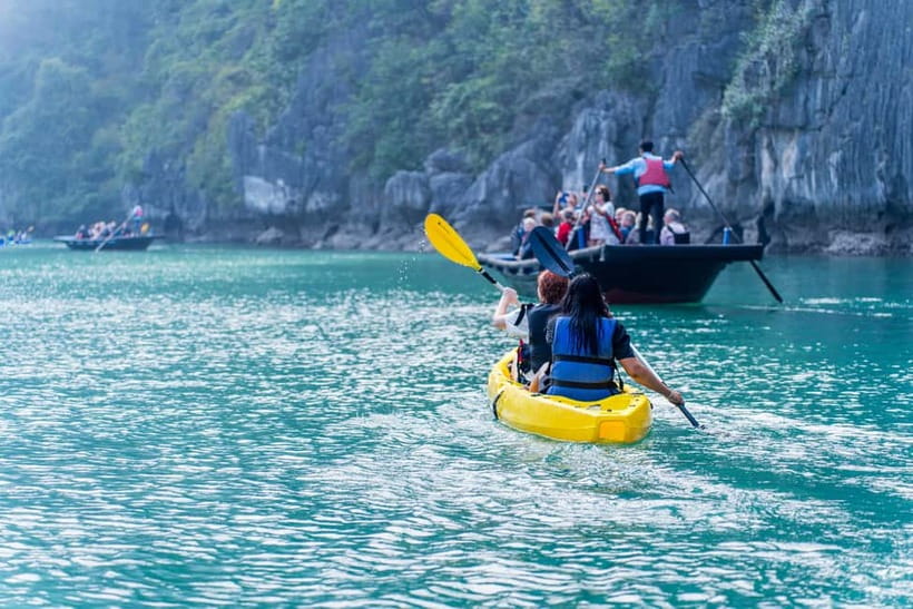 From Ha Long: Luxury Symphony Day Cruise with 2 Jacuzzi Pool - Luon Cave at mid-afternoon: optional kayak or sampan for a quieter bay moment