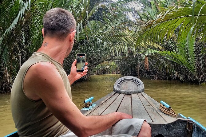 From Ho Chi Minh City: Discover Mekong Delta & Coconut Village - Switching into the smaller canals near Ben Tre