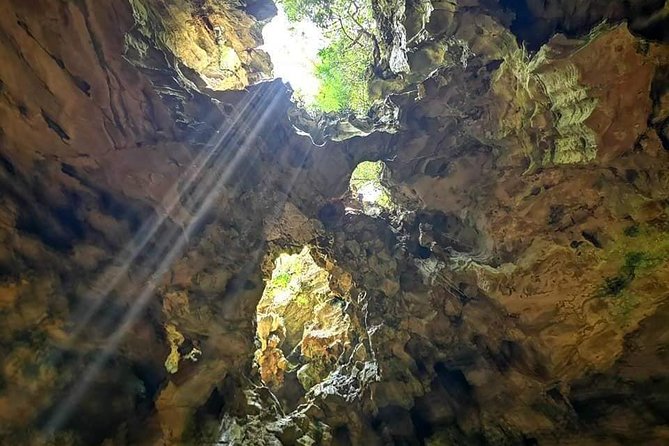 Guided Tour to Marble Mountains & Hoi An Walking Tour , Night Market, Boat Ride - Entering Hoi An Ancient Town on foot: bridges, assembly halls, and market sights