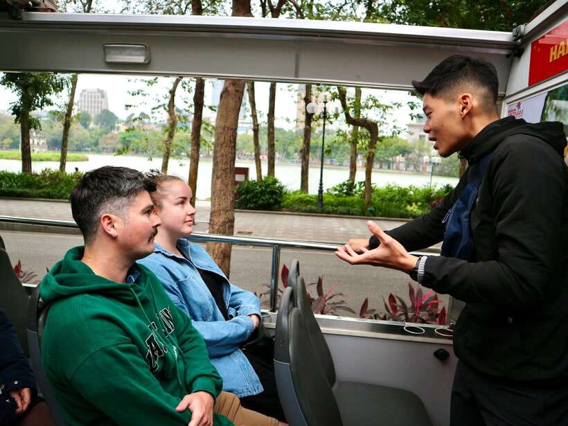 Hanoi Exclusive Craft Beer Bus: Cultural Sightseeing Tour - Dong Xuan Market shopping with beer in the middle of it