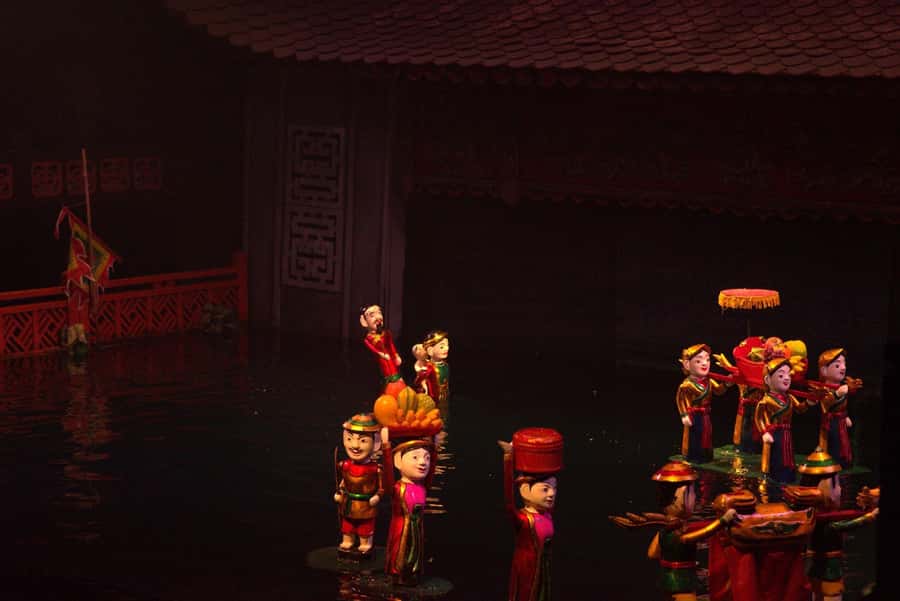 Hanoi: Street Food Walking Tour & Water Puppet Show - Entering Hanoi’s Old Quarter, where streets had jobs