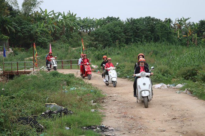 Hanoi Vespa Countryside Tour With Female Ao Dai Riders Half Day - Temple and pagoda time, including a site tied to 257 BC
