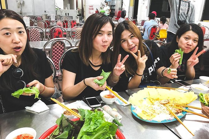 Saigon Afternoon Unseen Street Food by Scooter |Opt: Ao Dai Rider - Motorbike Logistics and Safety: Helmets, Ponchos, and the Ao Dai Rider Option
