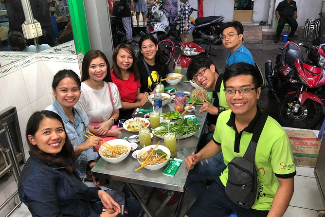 Saigon By Night and Street Food By Motorbike | Opt: Ao Dai Riders - Stop 4: Nguyen Van Cu Bridge, Saigon River air, and a night panorama