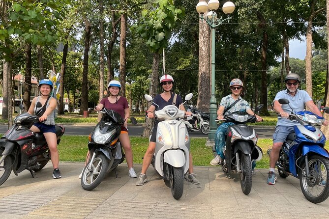 Saigon Unseen, History, & Hidden Gems Sightseeing Motorbike Tour - Getting On The Scooters Near Saigon Opera House